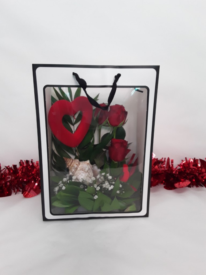 Valentine's decoration with fresh roses in bag
