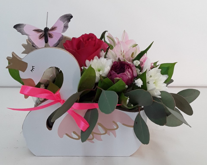 Fresh flowers in wooden creation