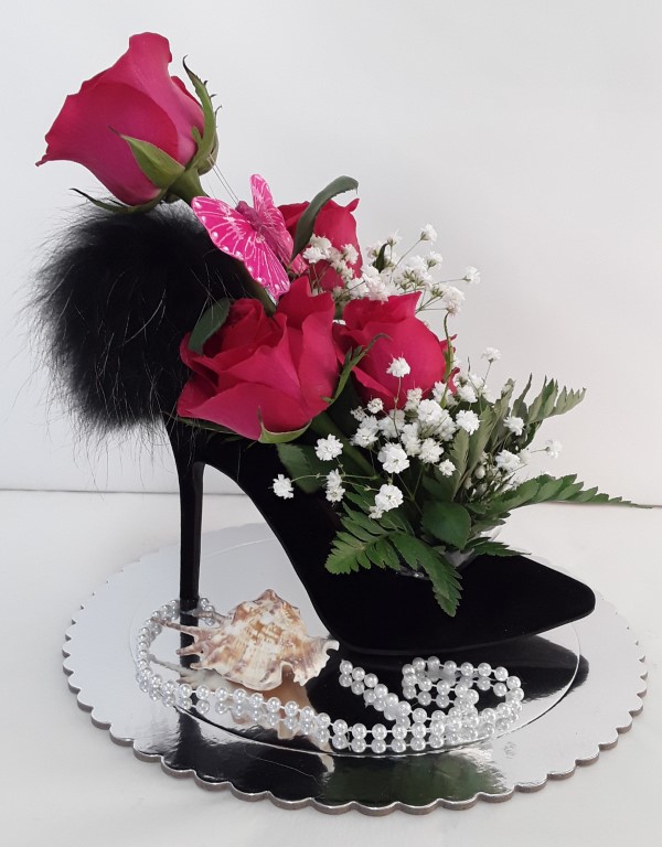 Fresh roses in stiletto heel