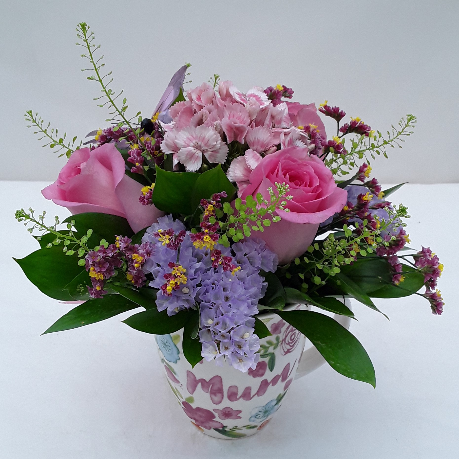 Mixed flowers in cup