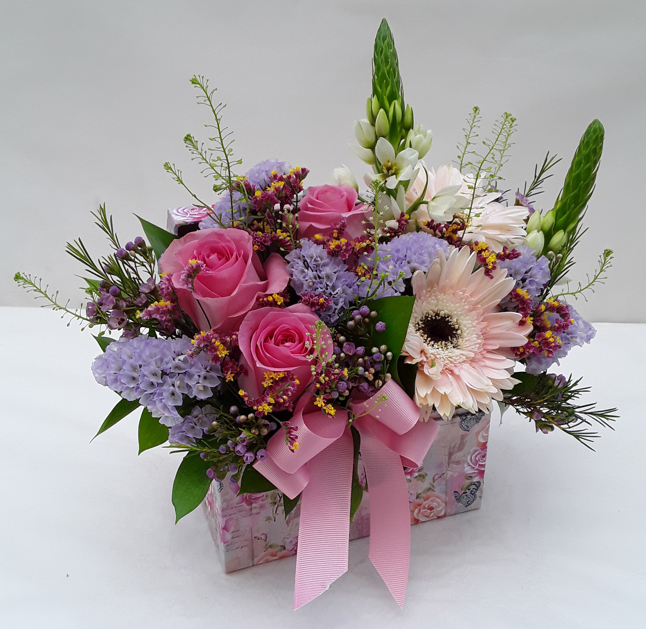 Mixed flowers in small chest