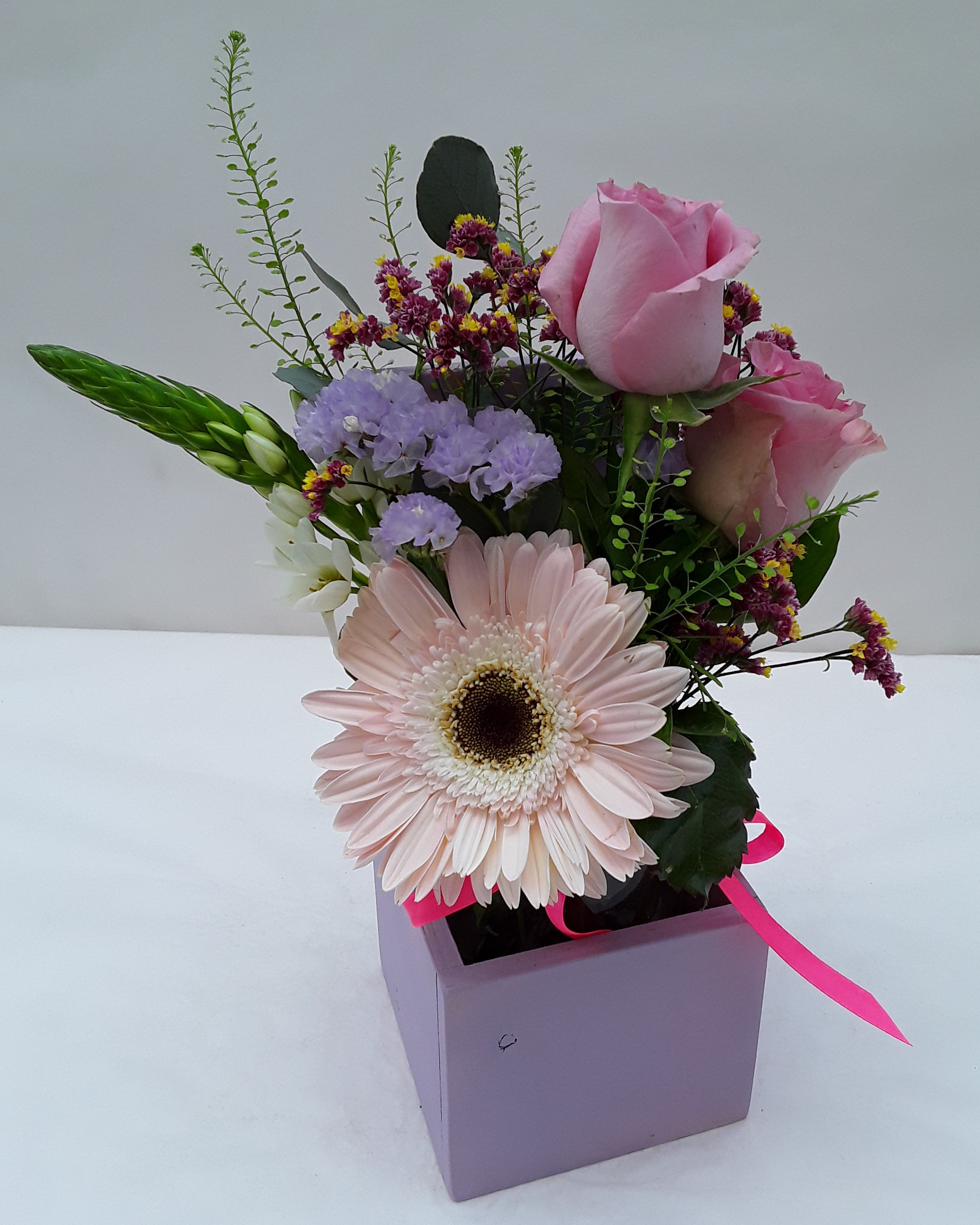 Mixed flowers in big wooden base