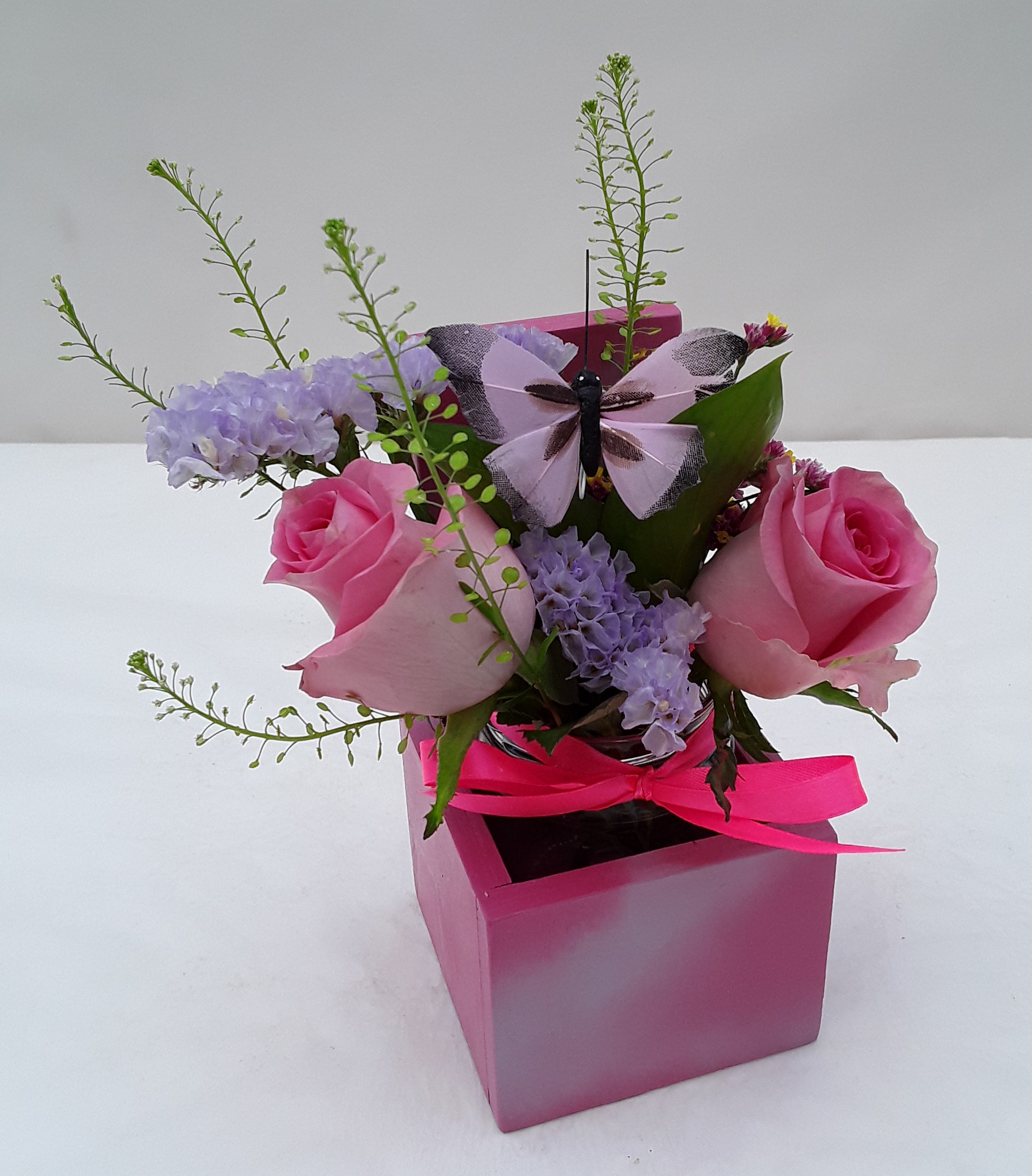Mixed flowers in small wooden base