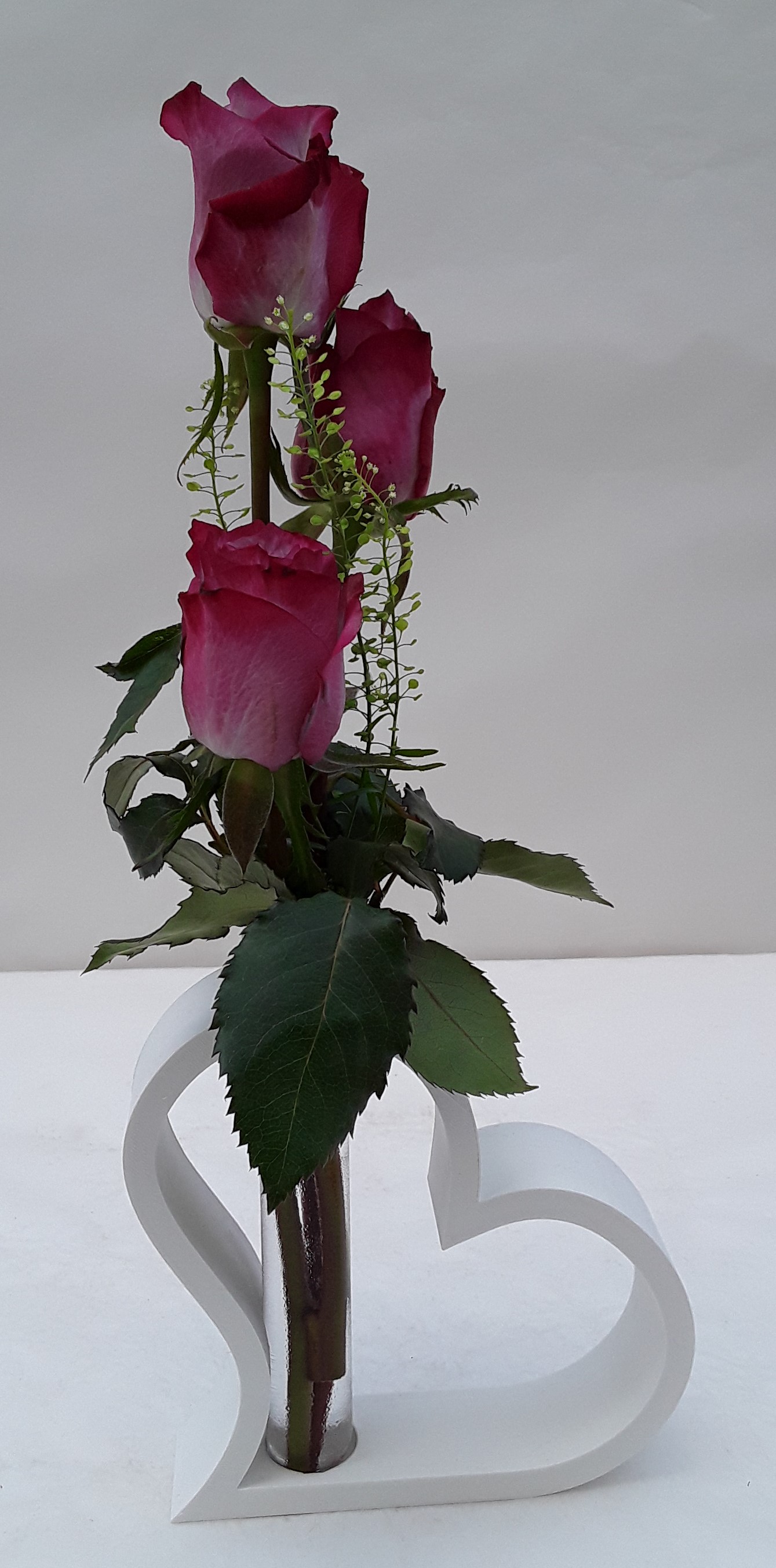 Wooden white heart with roses