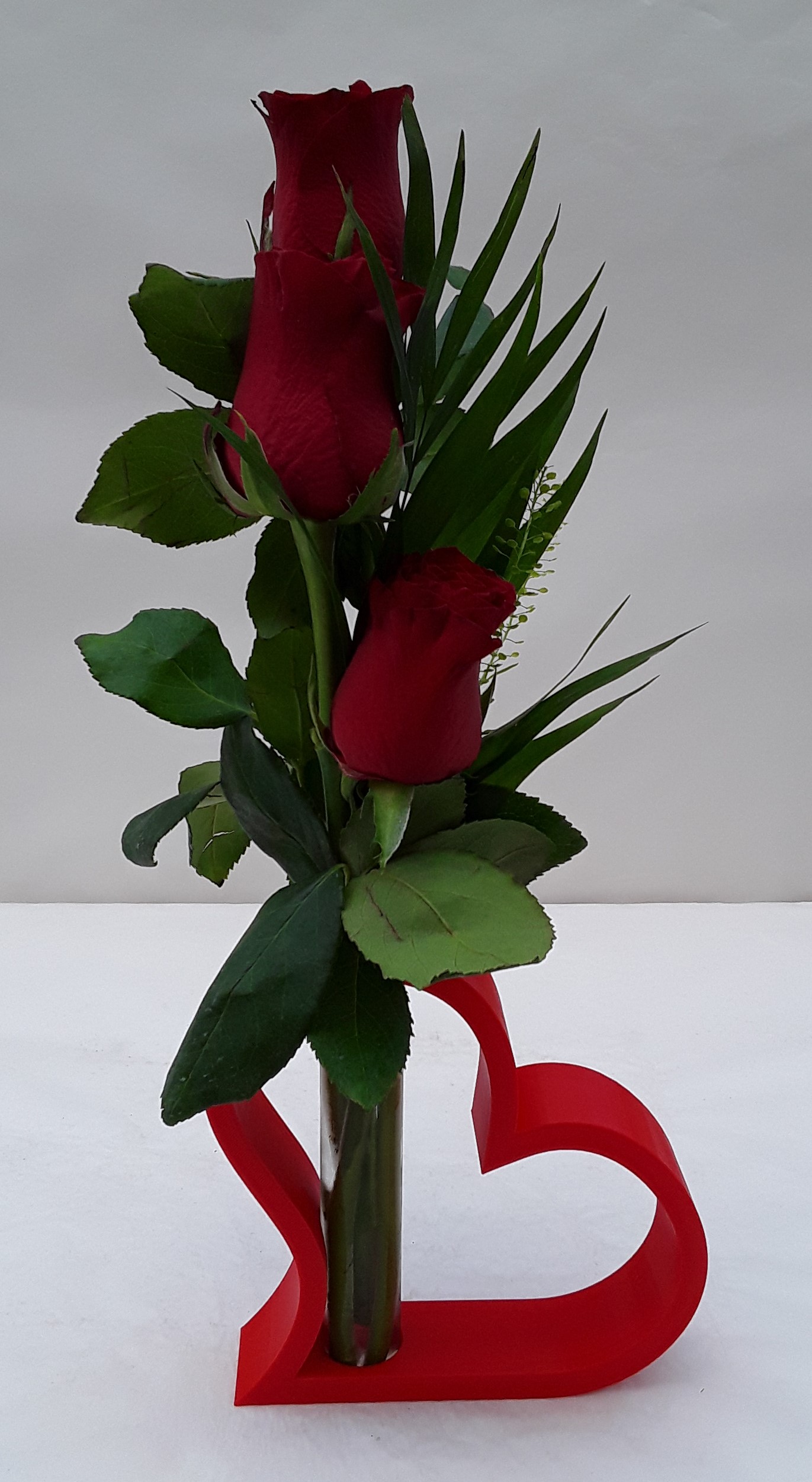 Wooden red heart with roses