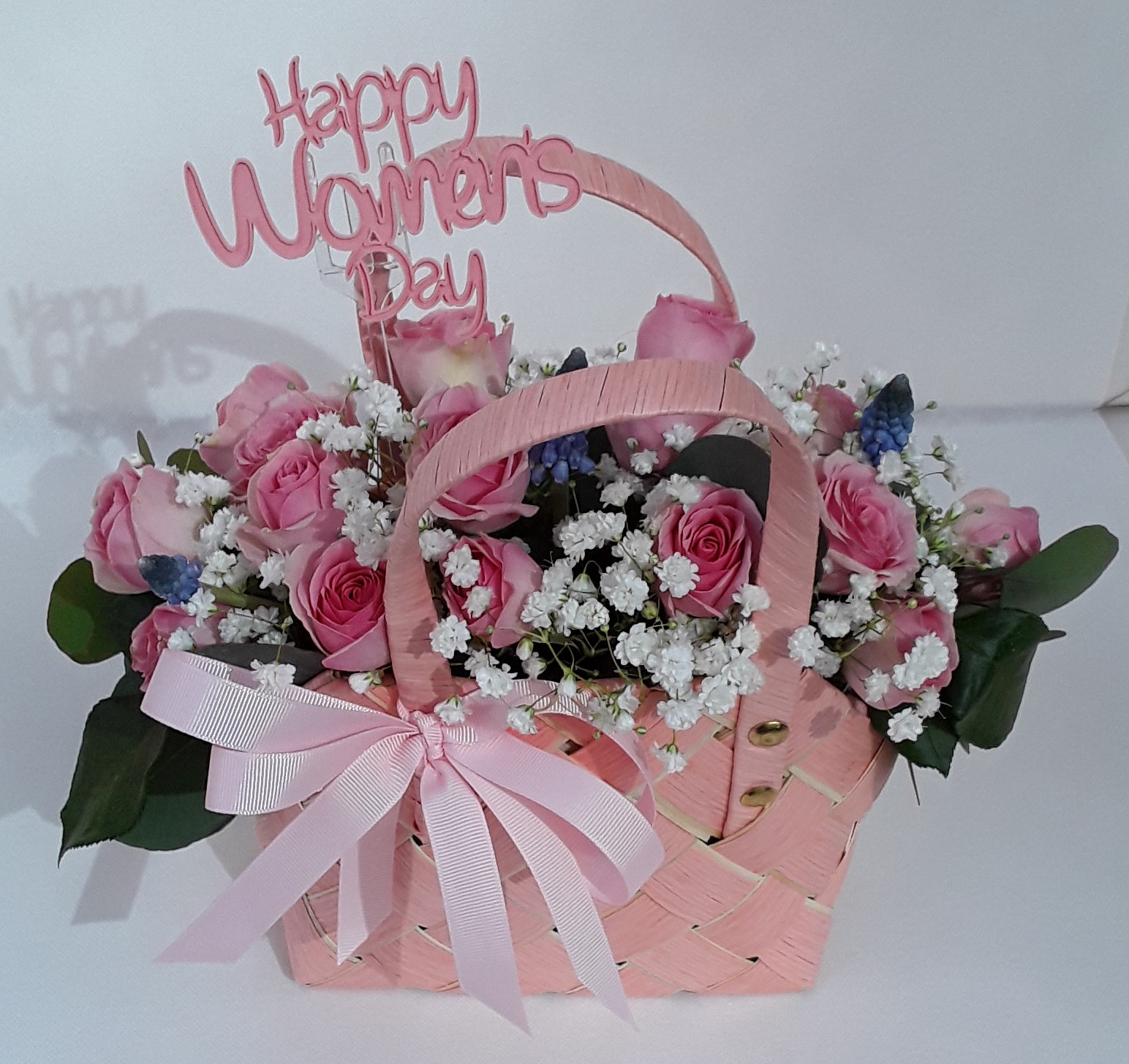 Pink bag mixed seasonal flowers