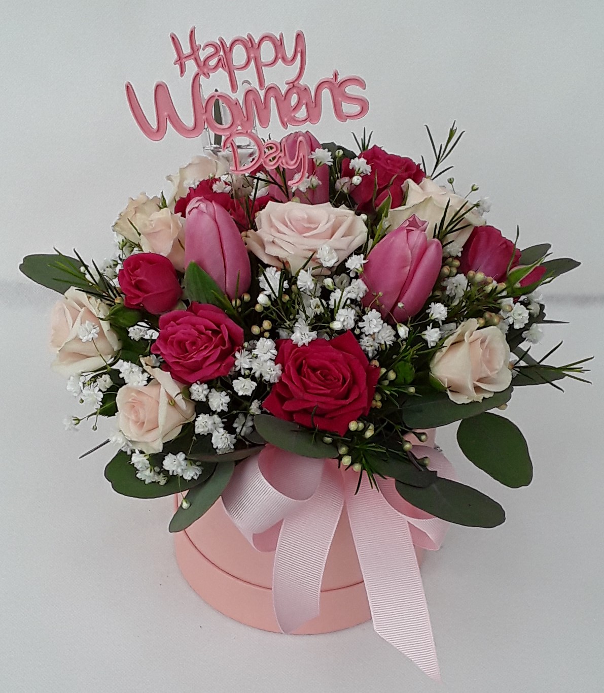 Mini roses and tulips in a box