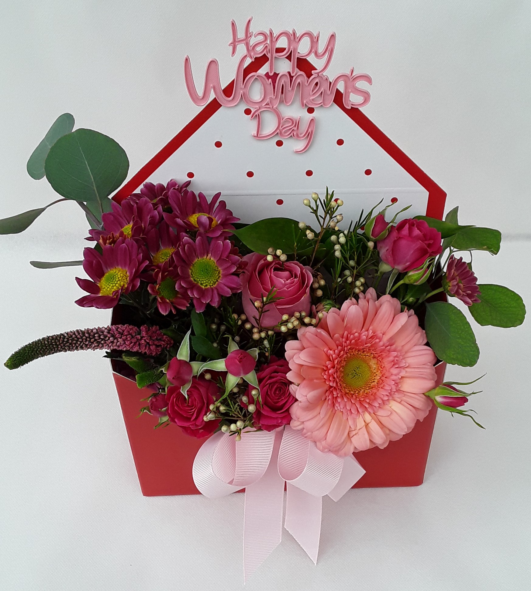 Red letter box with mixed flowers