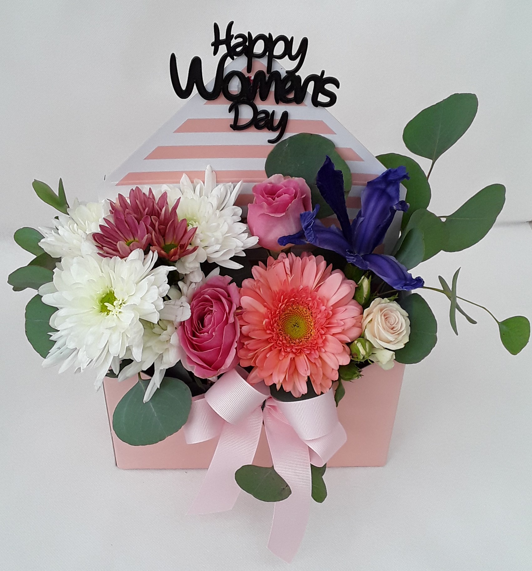 Pink letter box with mixed flowers