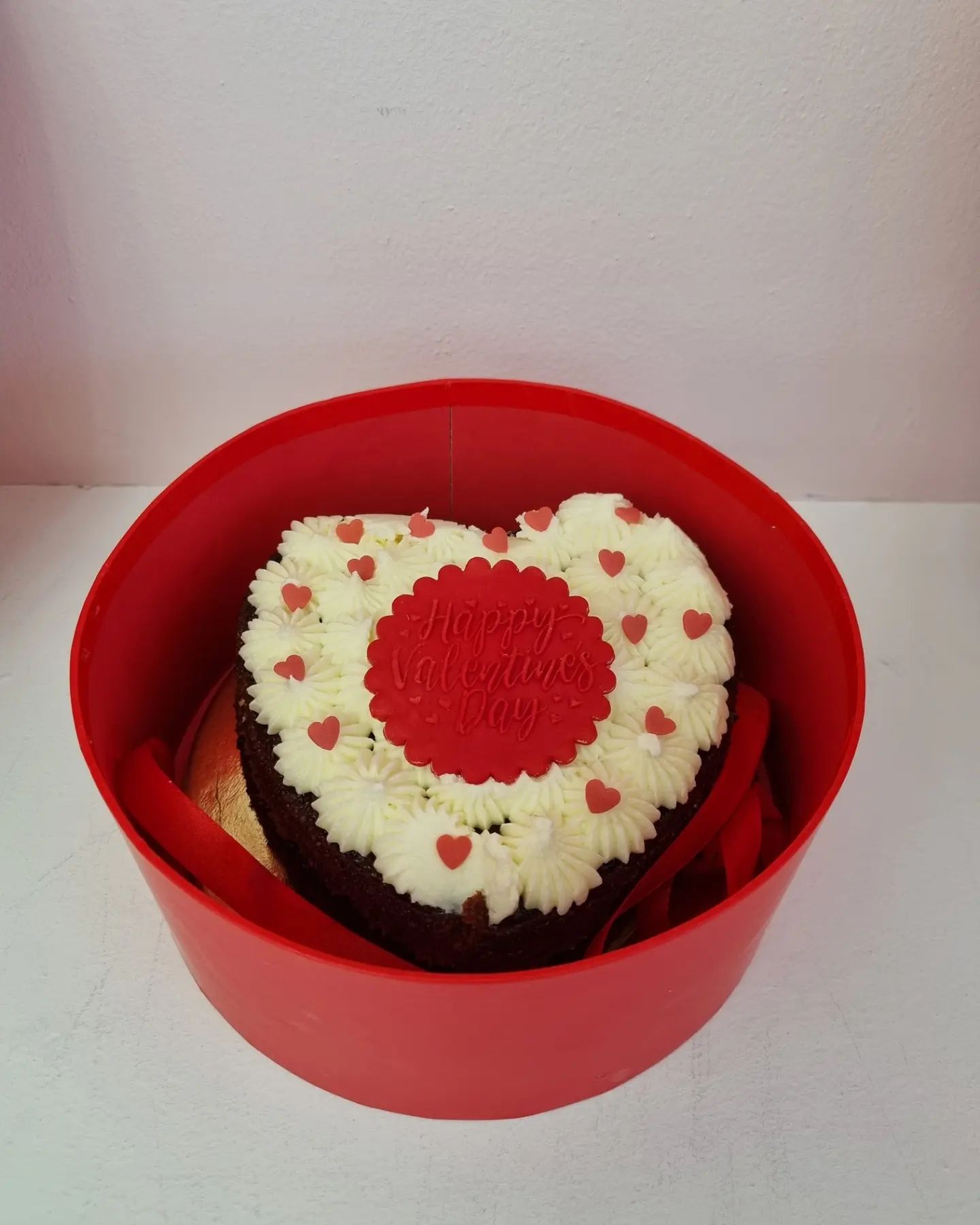 Two layer heart shaped  Valentine's cake in a gift box