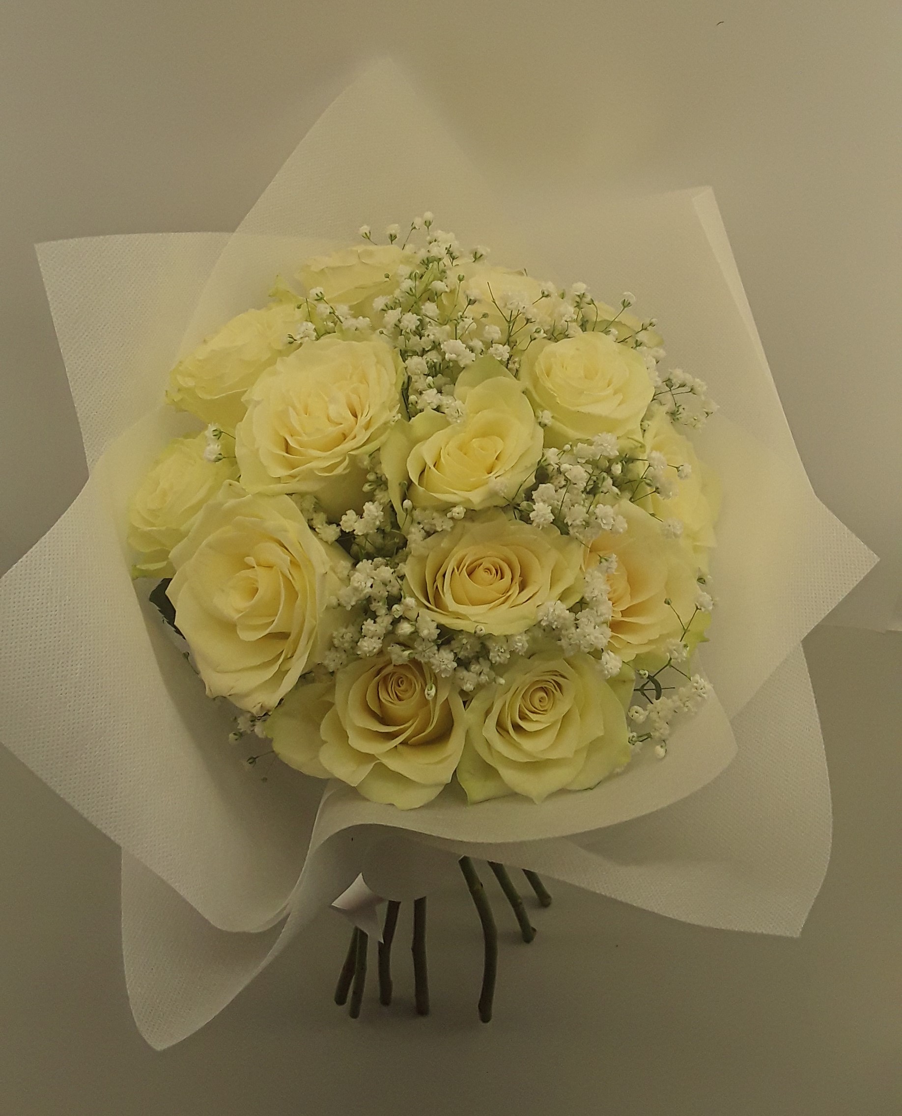 15 white roses in a bouquet