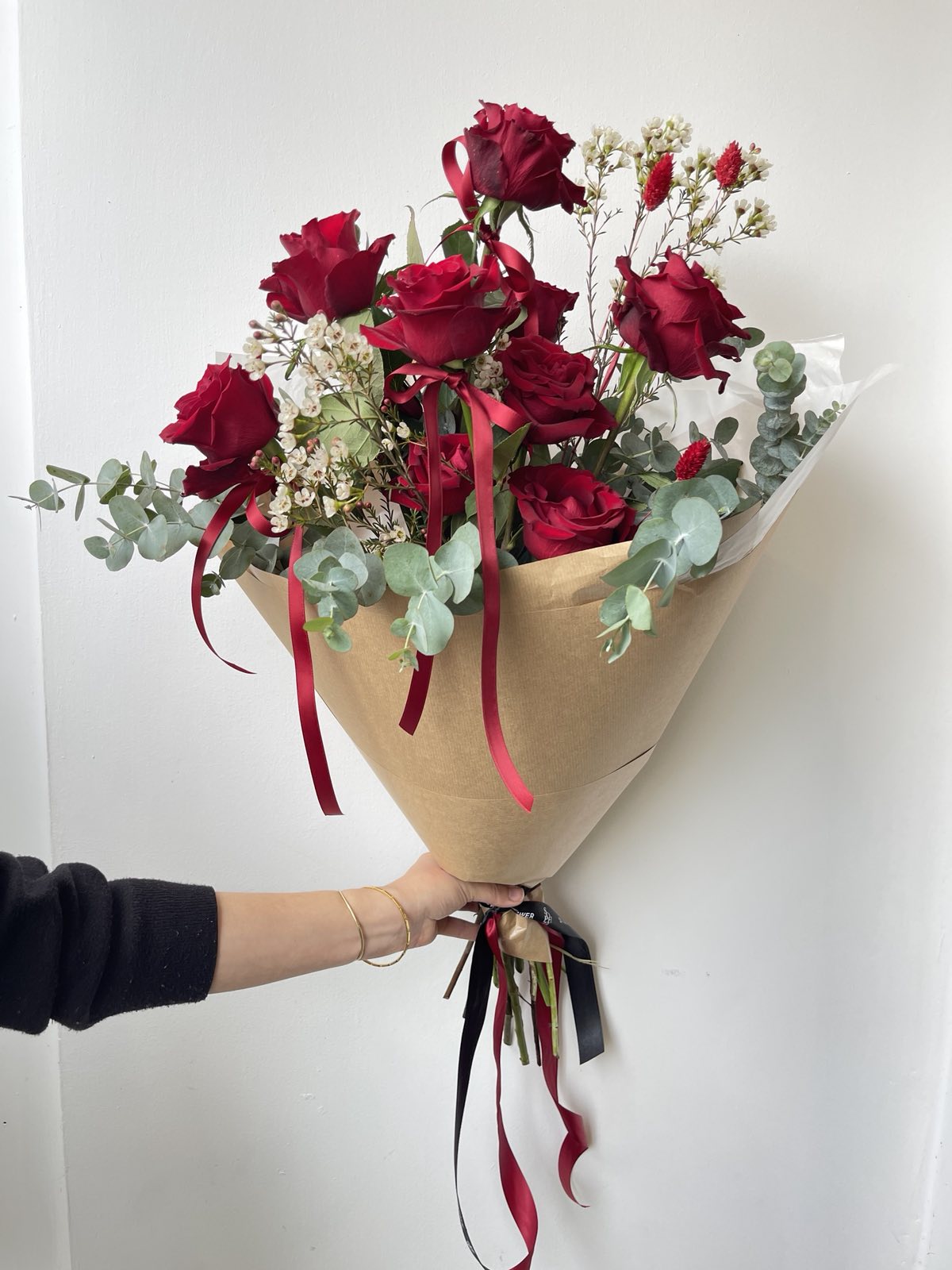 10 Red roses with greenery and Wax