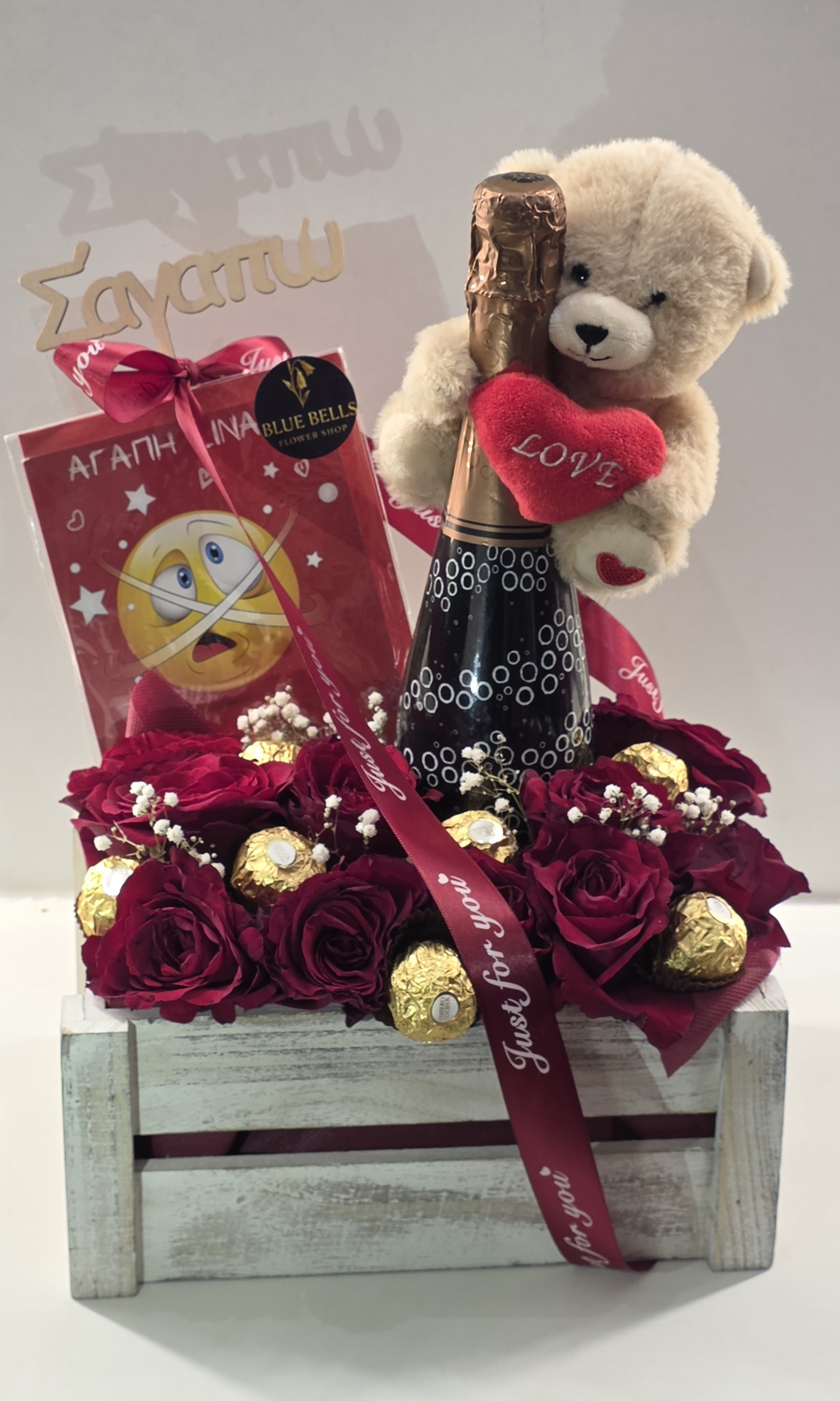 1Big Champaign ,1 Small Tady Bear,1 Card, 1 Wooden Box,6-8 Chocolate Roche & 9-11 Roses