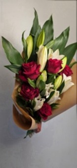 5 First quality red roses, 3 stem Lily Oriental with seasonal grenery