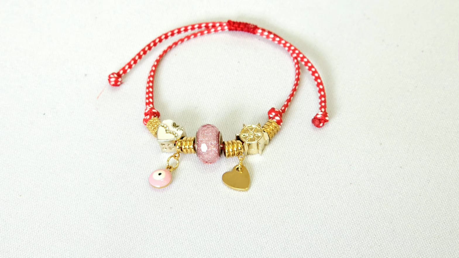Martaki Bracelet With Stainless Steel Pink Charms, Hanging Pink Eye And Stinless Steel Heart.