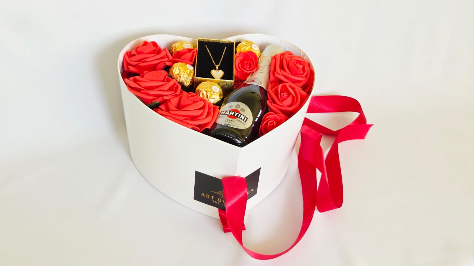 HEART NECKLACE IN WHITE HEART BOX WITH ASTI  SPARKLING WINE.