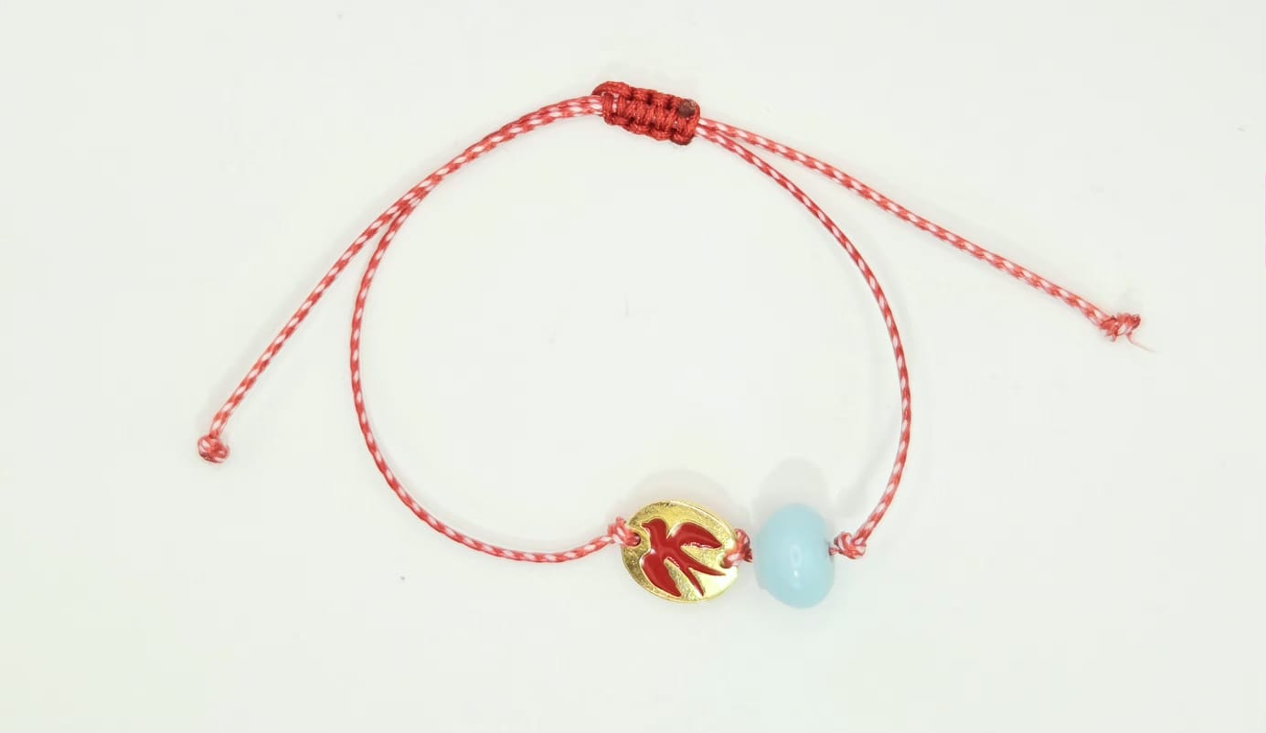 Martaki with swallow and light blue bead.