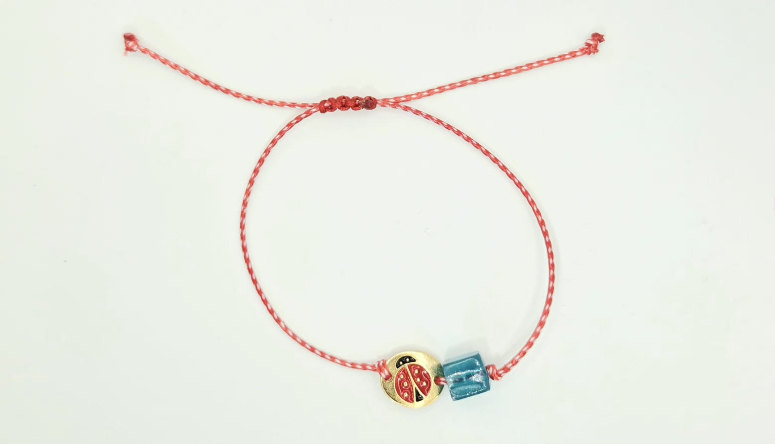 Martaki with ladybug and blue bead.