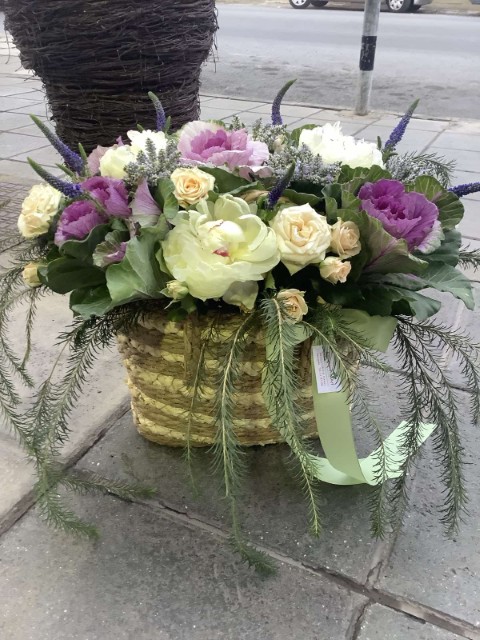 Flower Arrangement with pink and purple roses in Basket