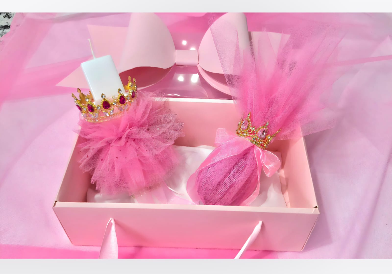 EASTER CANDLE WITH CROWN ,EGG WITH CROWN IN A  PINK BOX WITH BOW.
