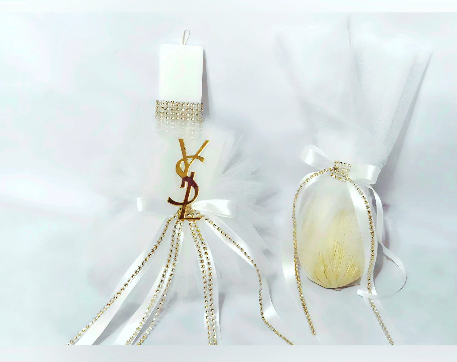 EASTER CANDLE AND EGG WHITE -GOLD,WITH YVE SAINT LAURENT DECORATION.
