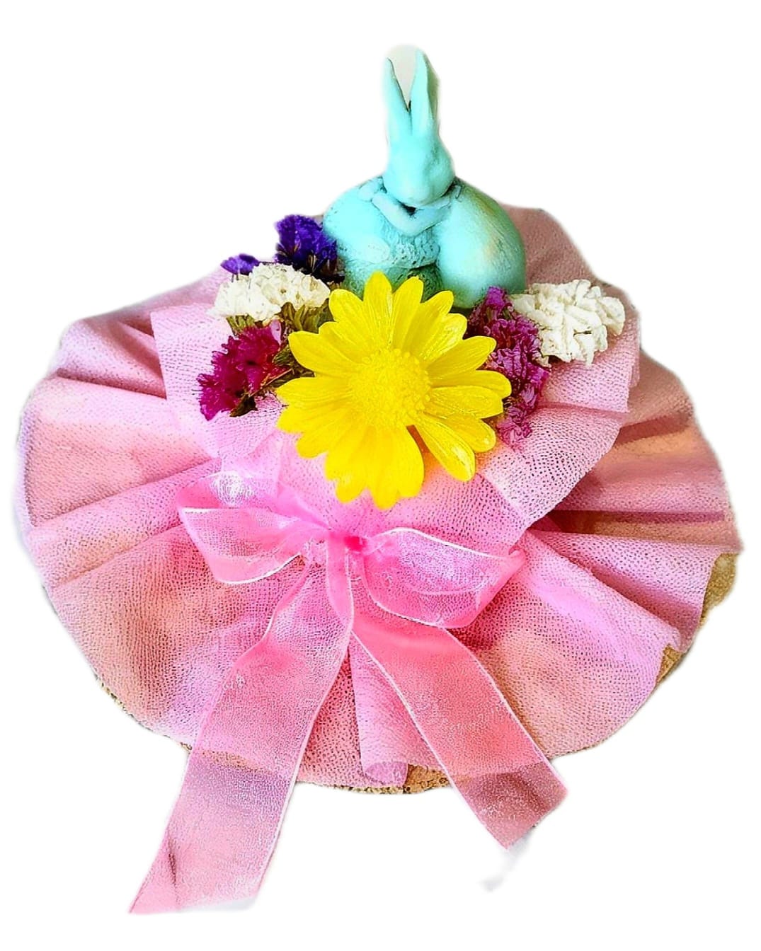 LIGHT BLUE BUNNY AND FLOWERS ON A WOODEN BASE.